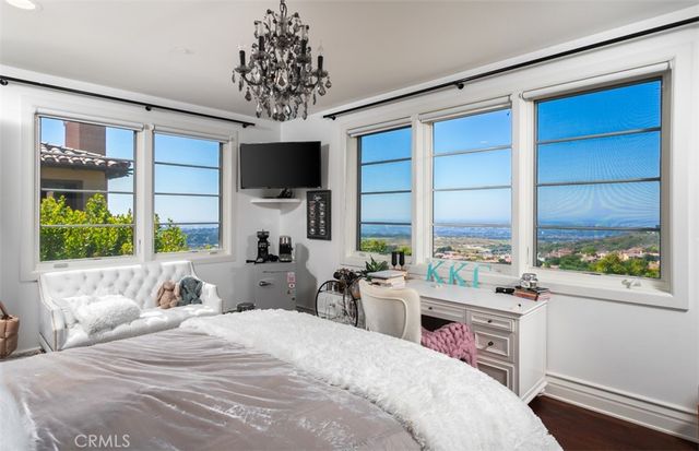 an aerial view of residential houses with city view