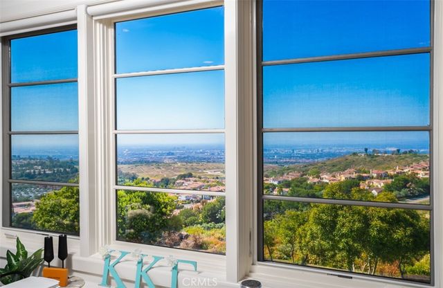 a view of a house with swimming pool and sitting area