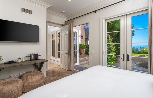 a view of swimming pool with outdoor seating and city view