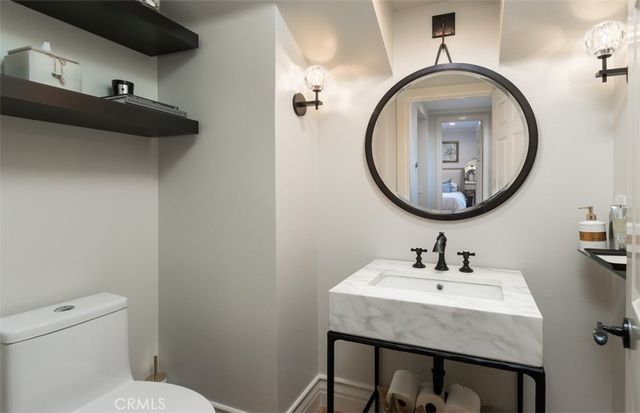 a view of a house with backyard porch and sitting area