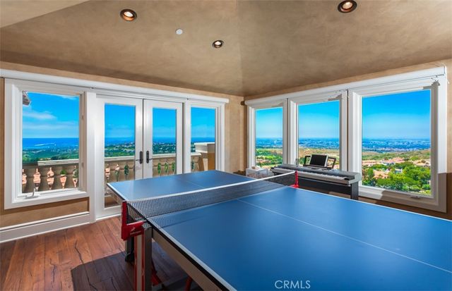 a view of swimming pool with outdoor seating and plants