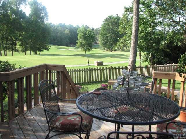 1409 Hunting Ridge Road Raleigh, NC 27615 - Photo 5 of 12 The deck is the perfect spot for relaxing and enjoying spectacular views of North Ridge's beautiful golf course. View