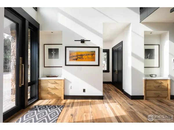 a view of a living room with wooden floor