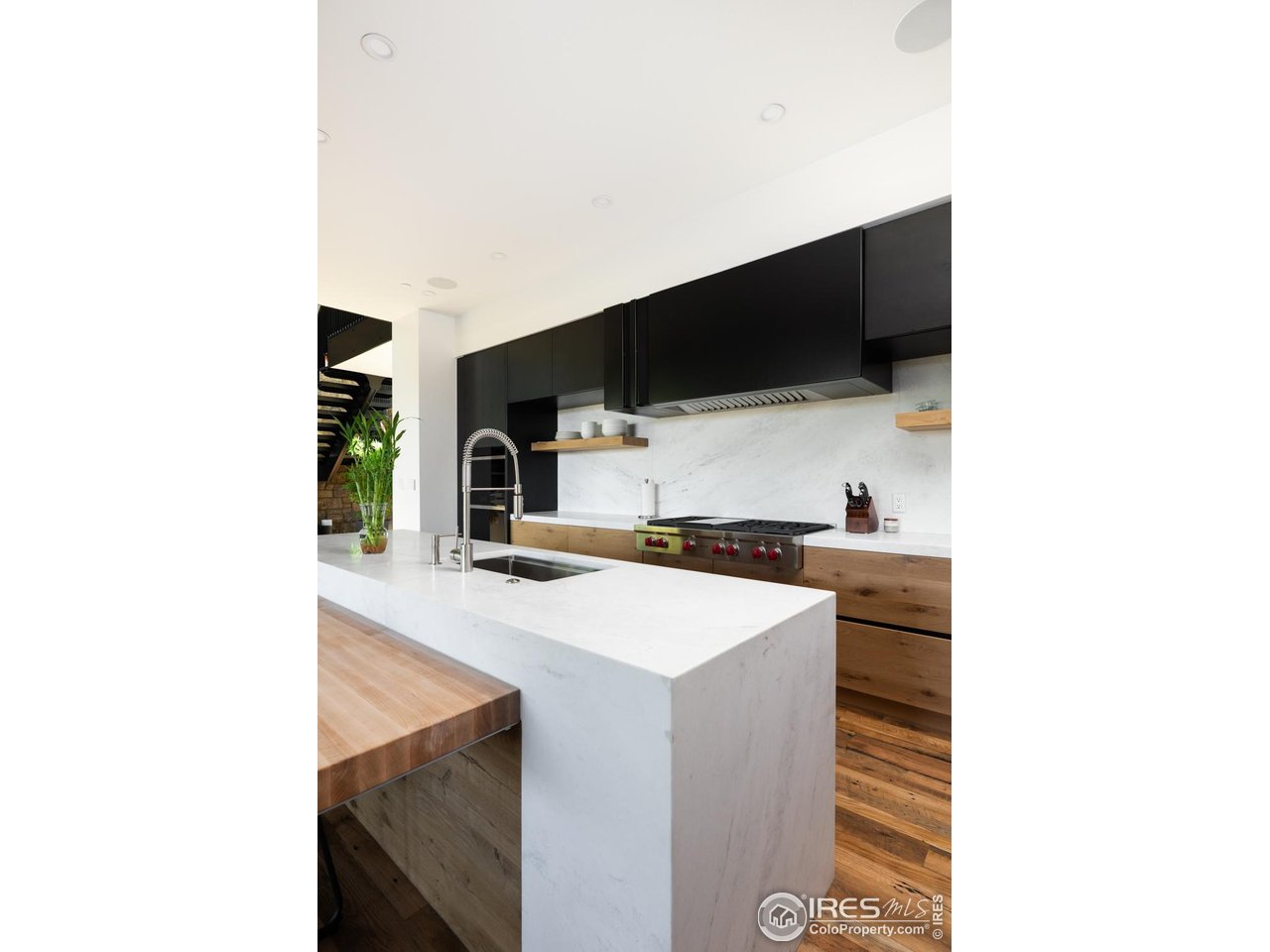12357 North 75th Street Longmont, CO 80503 - Photo 16 of 49 a kitchen with a sink and a microwave