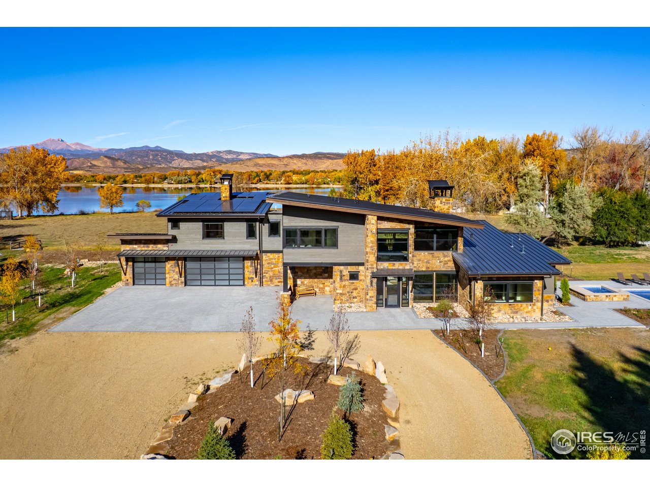 12357 North 75th Street Longmont, CO 80503 - Photo 2 of 49 a view of a house with pool and a yard