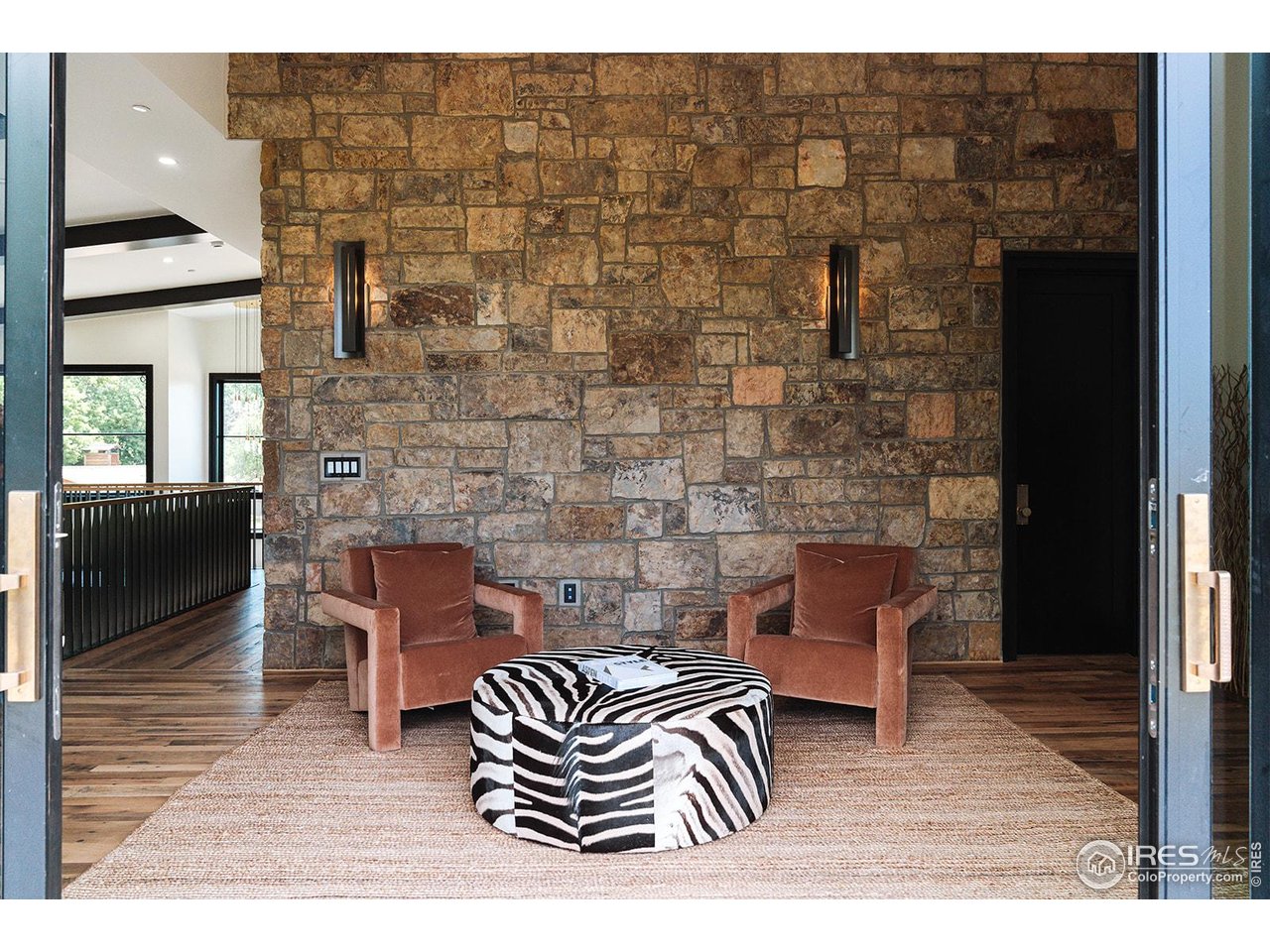 12357 North 75th Street Longmont, CO 80503 - Photo 23 of 49 a living room with furniture and a fireplace
