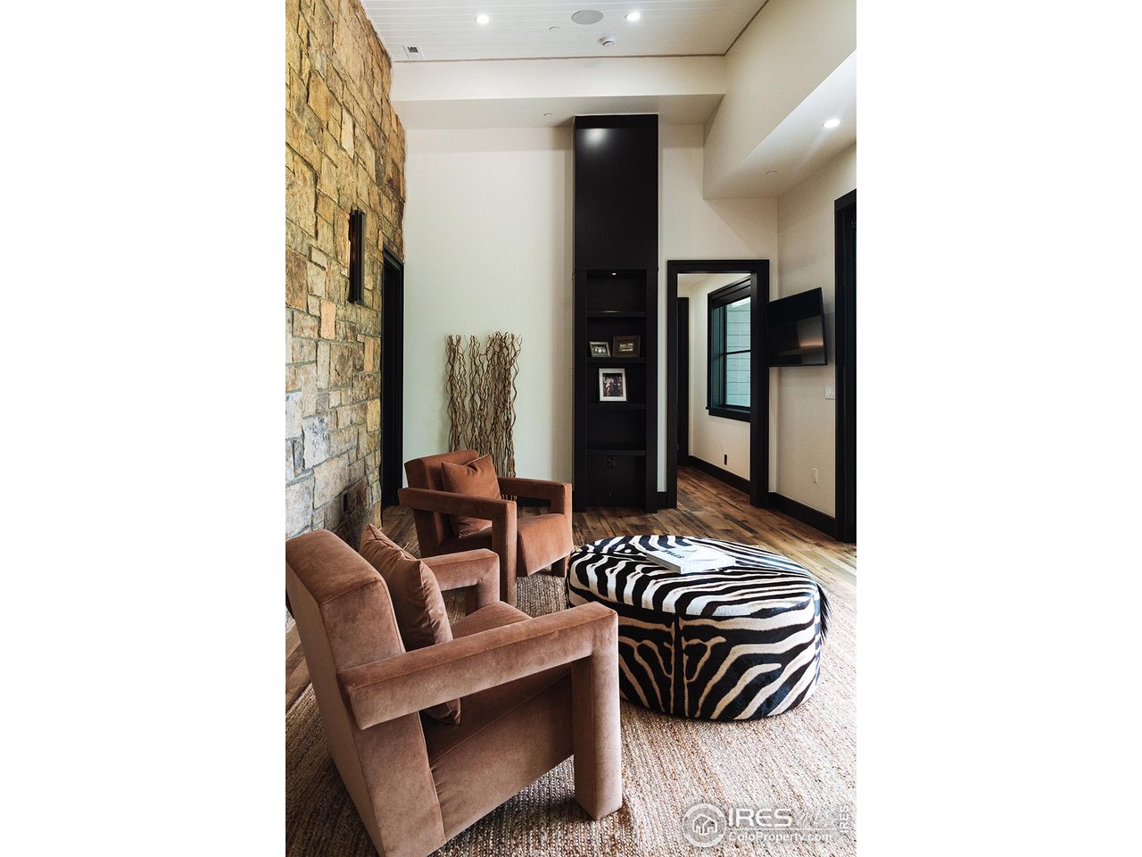 12357 North 75th Street Longmont, CO 80503 - Photo 24 of 49 a view of a hallway with couch and chandelier