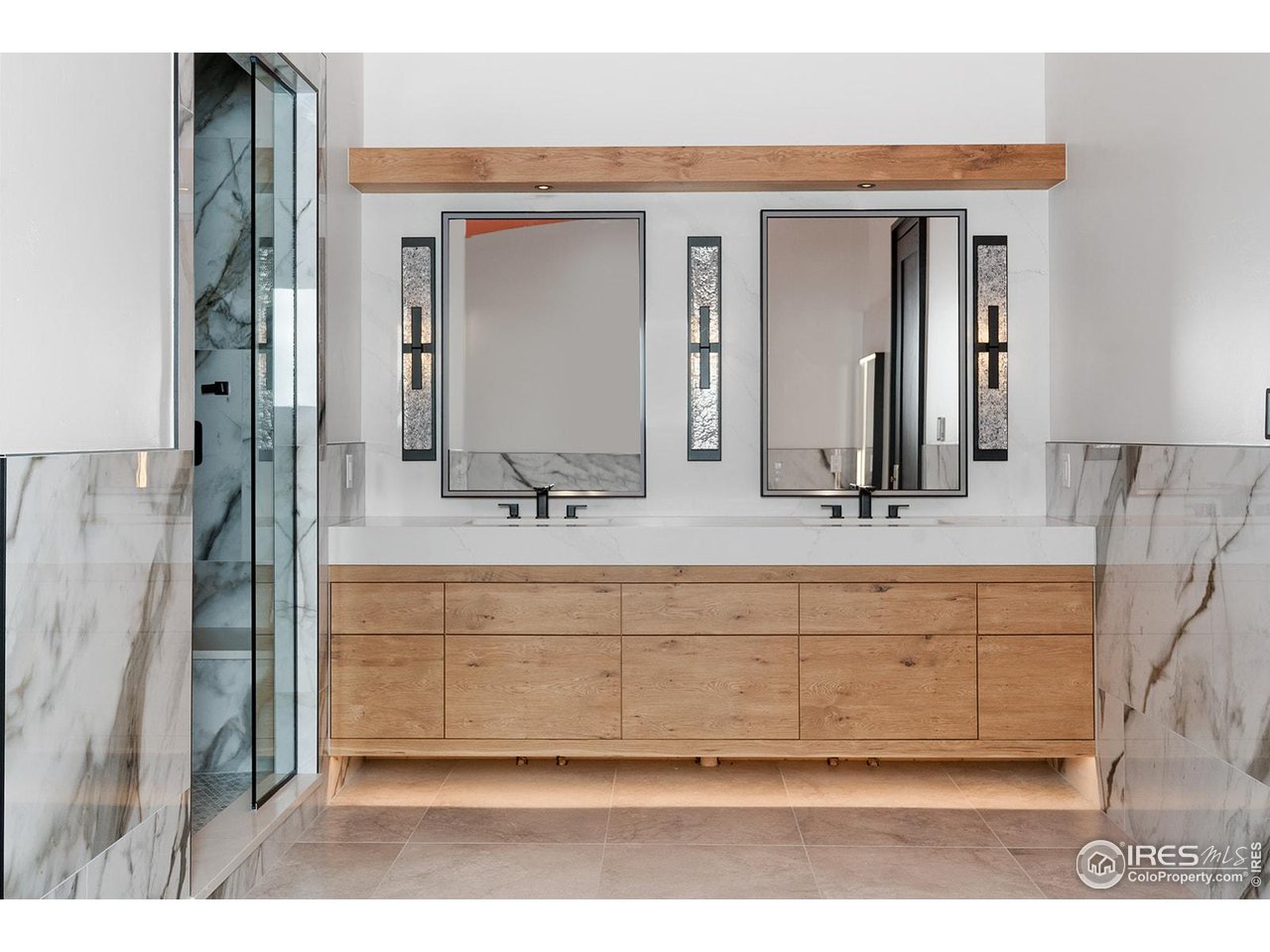 12357 North 75th Street Longmont, CO 80503 - Photo 31 of 49 a bathroom with a sink mirror and vanity