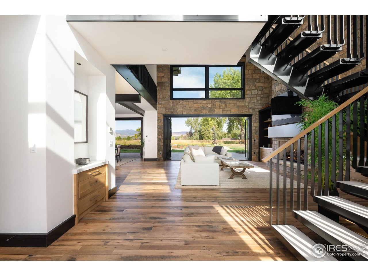 12357 North 75th Street Longmont, CO 80503 - Photo 5 of 49 a view of entryway and hall with wooden floor