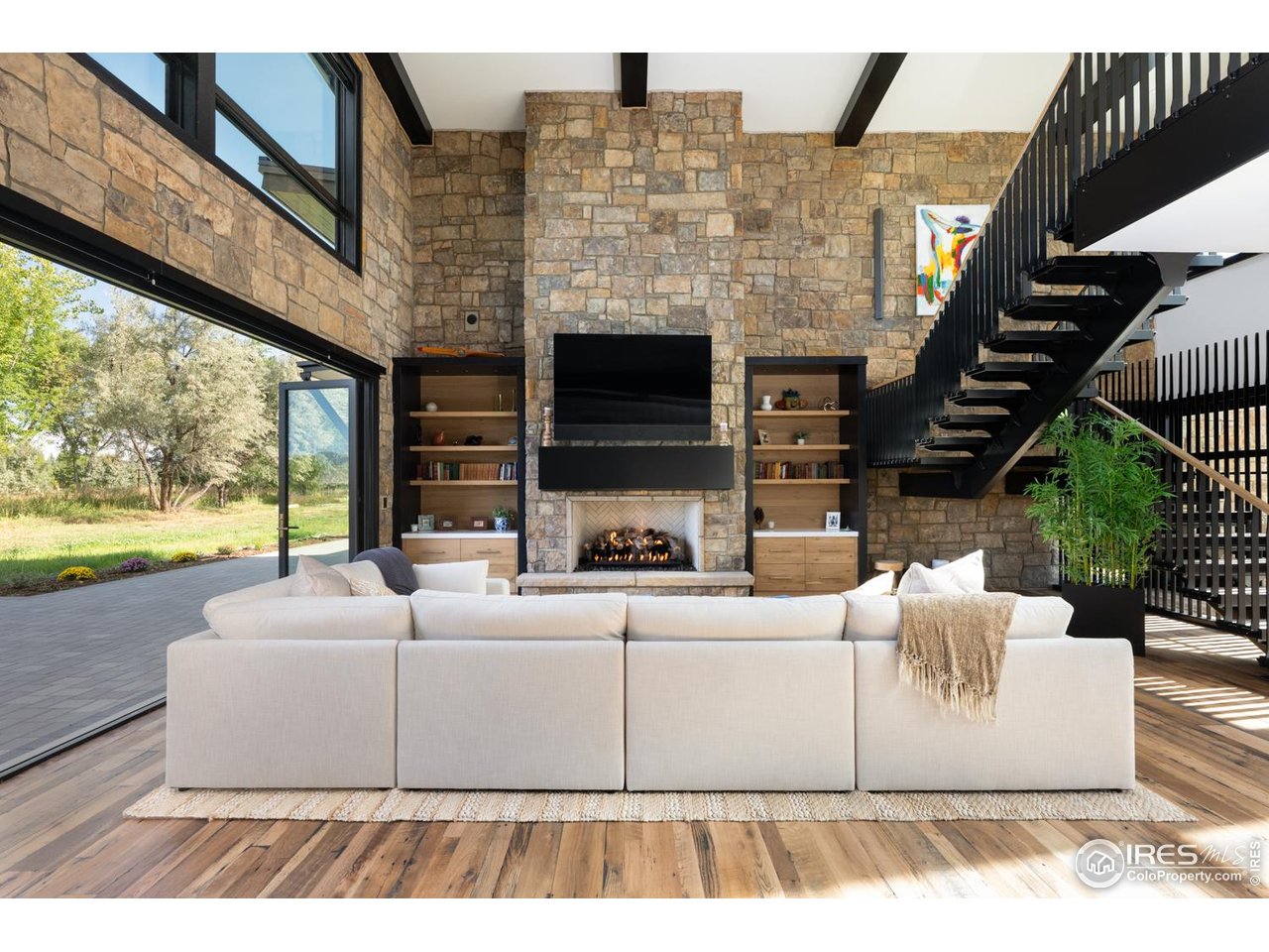 12357 North 75th Street Longmont, CO 80503 - Photo 10 of 49 a living room with fireplace furniture and a large window