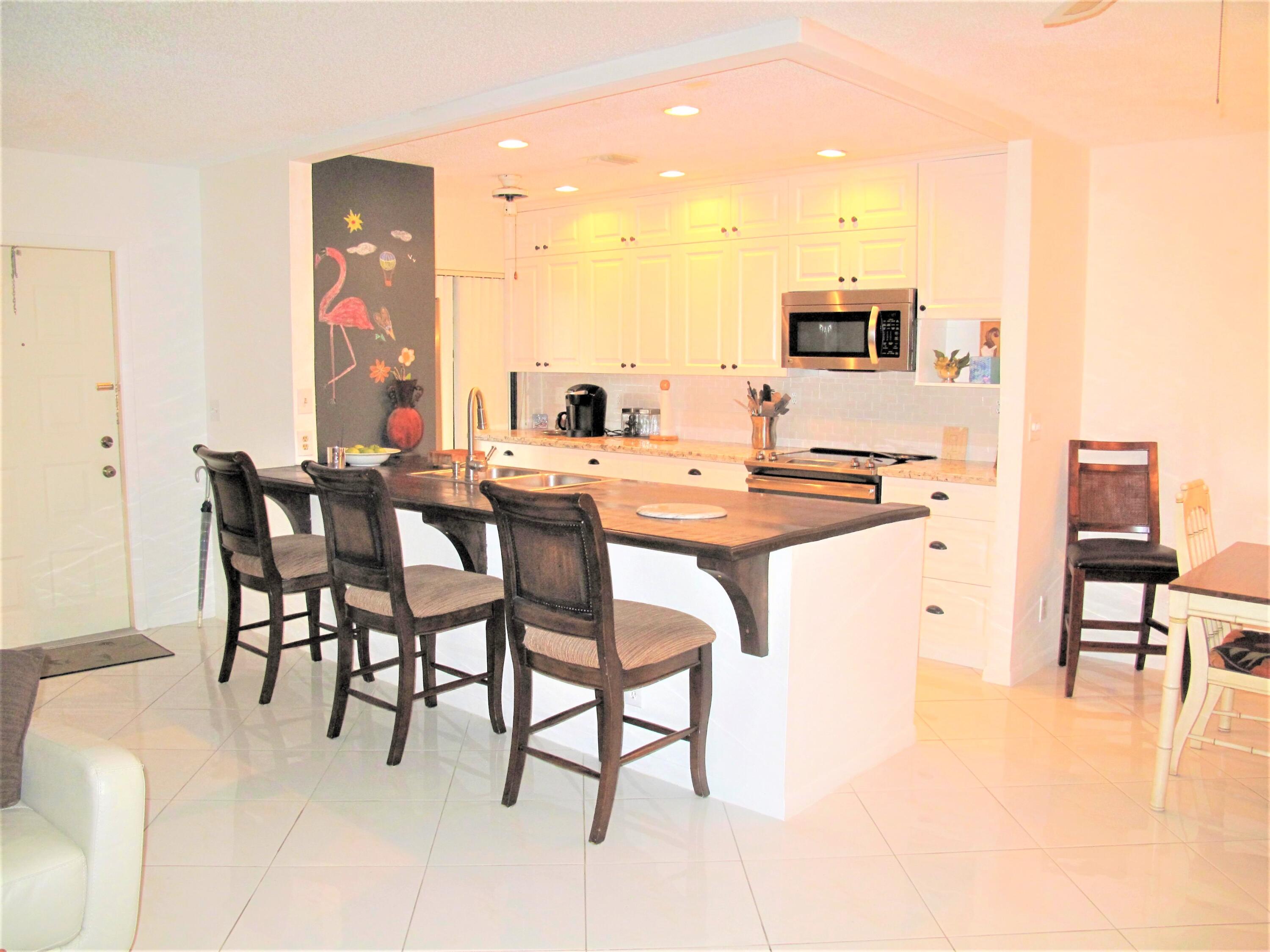 5031 Nesting Way, Unit D Delray Beach, FL 33484 - Photo 1 of 35 Open Concept Kitchen
