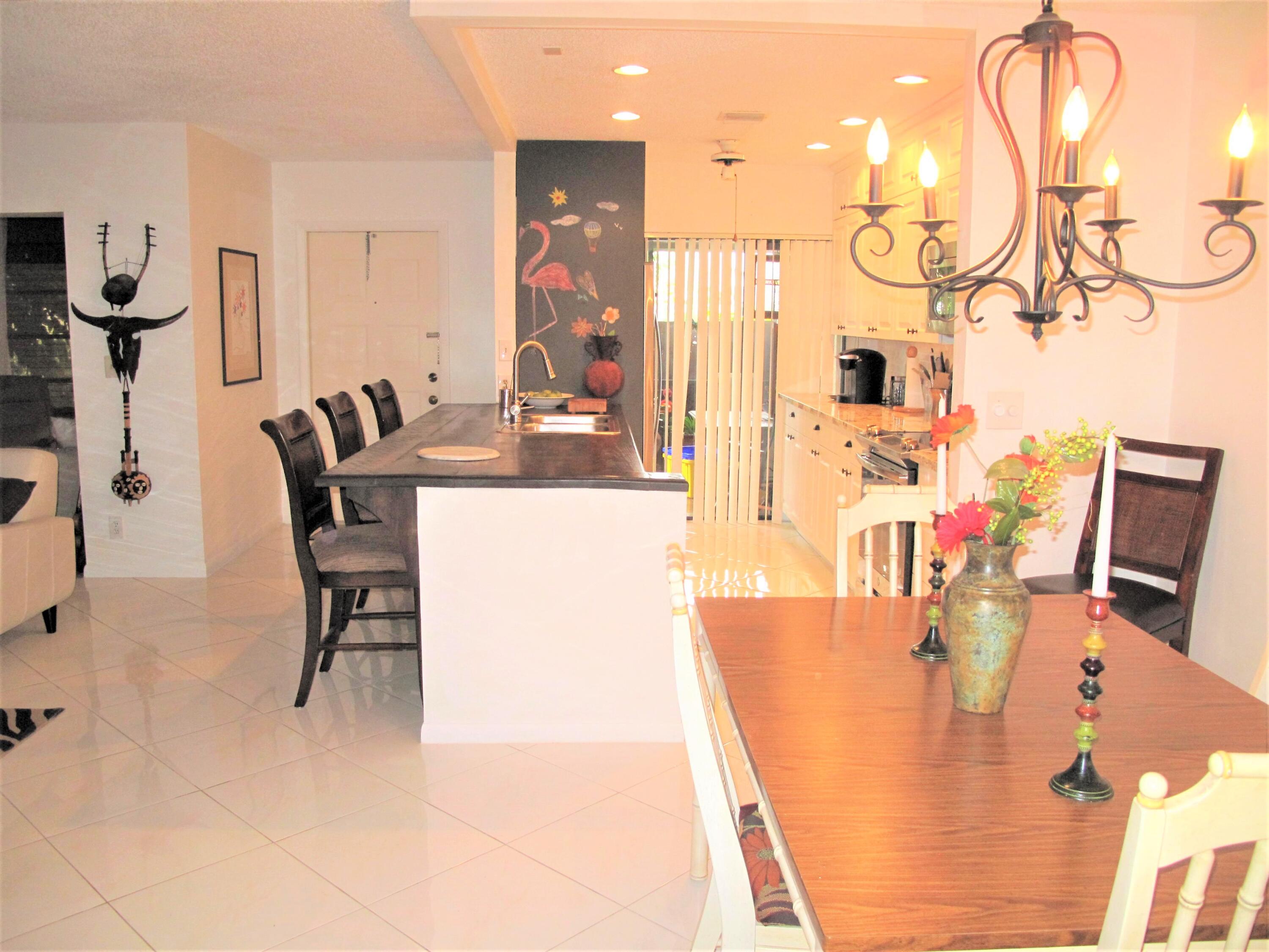 5031 Nesting Way, Unit D Delray Beach, FL 33484 - Photo 11 of 35 Kitchen and dining room view