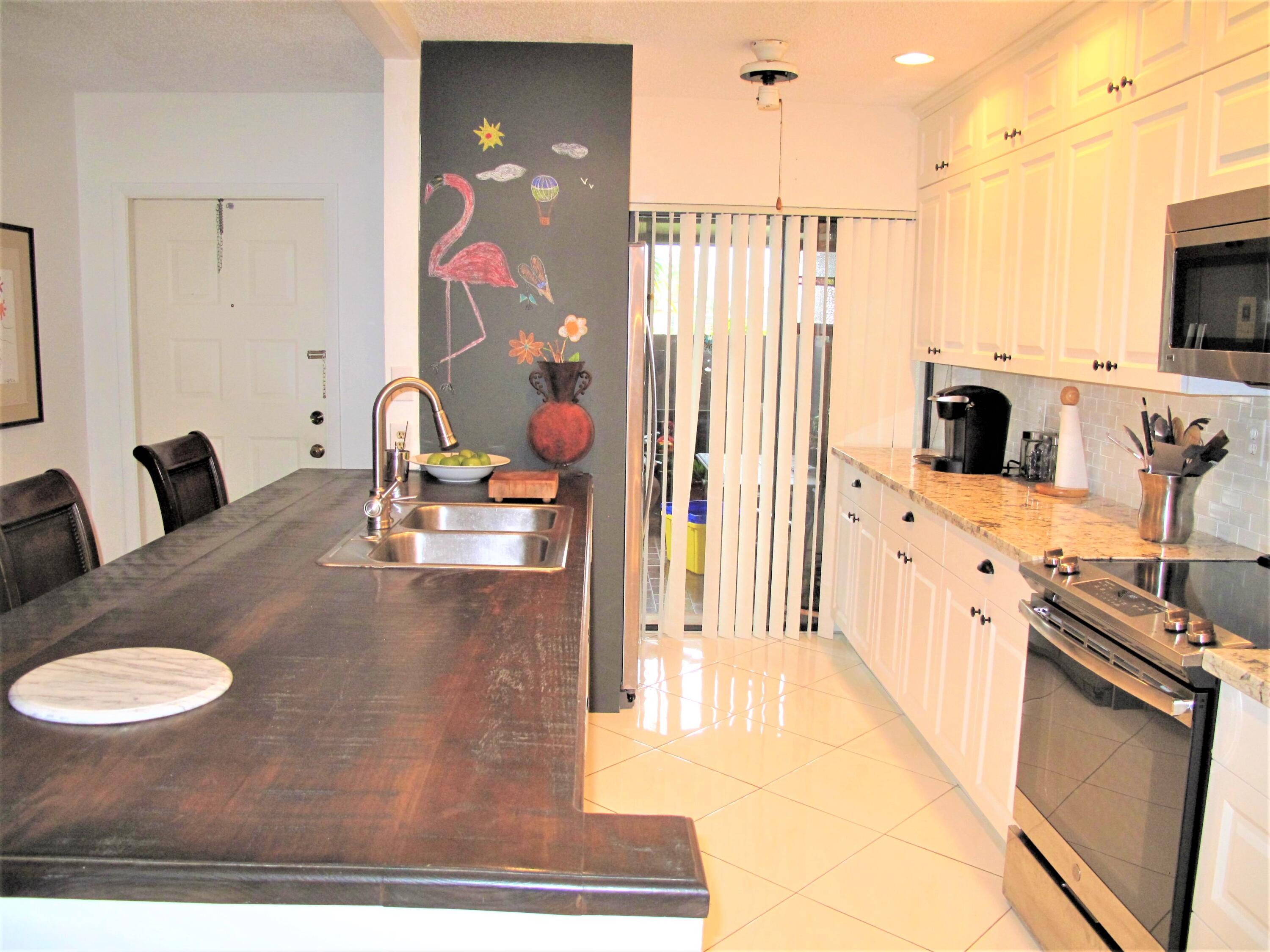 5031 Nesting Way, Unit D Delray Beach, FL 33484 - Photo 12 of 35 Open concept kitchen
