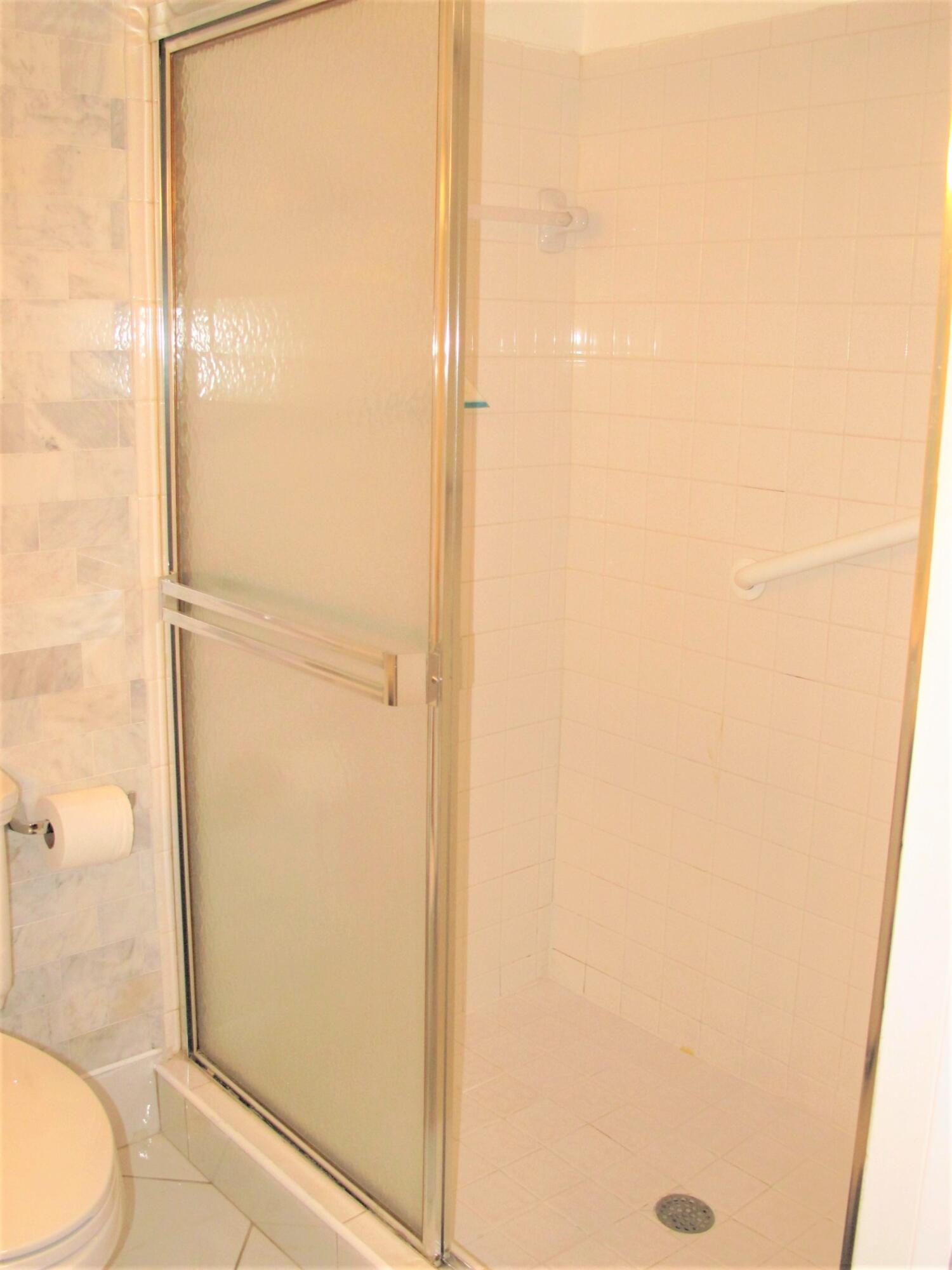 5031 Nesting Way, Unit D Delray Beach, FL 33484 - Photo 22 of 35 Guest bathroom shower