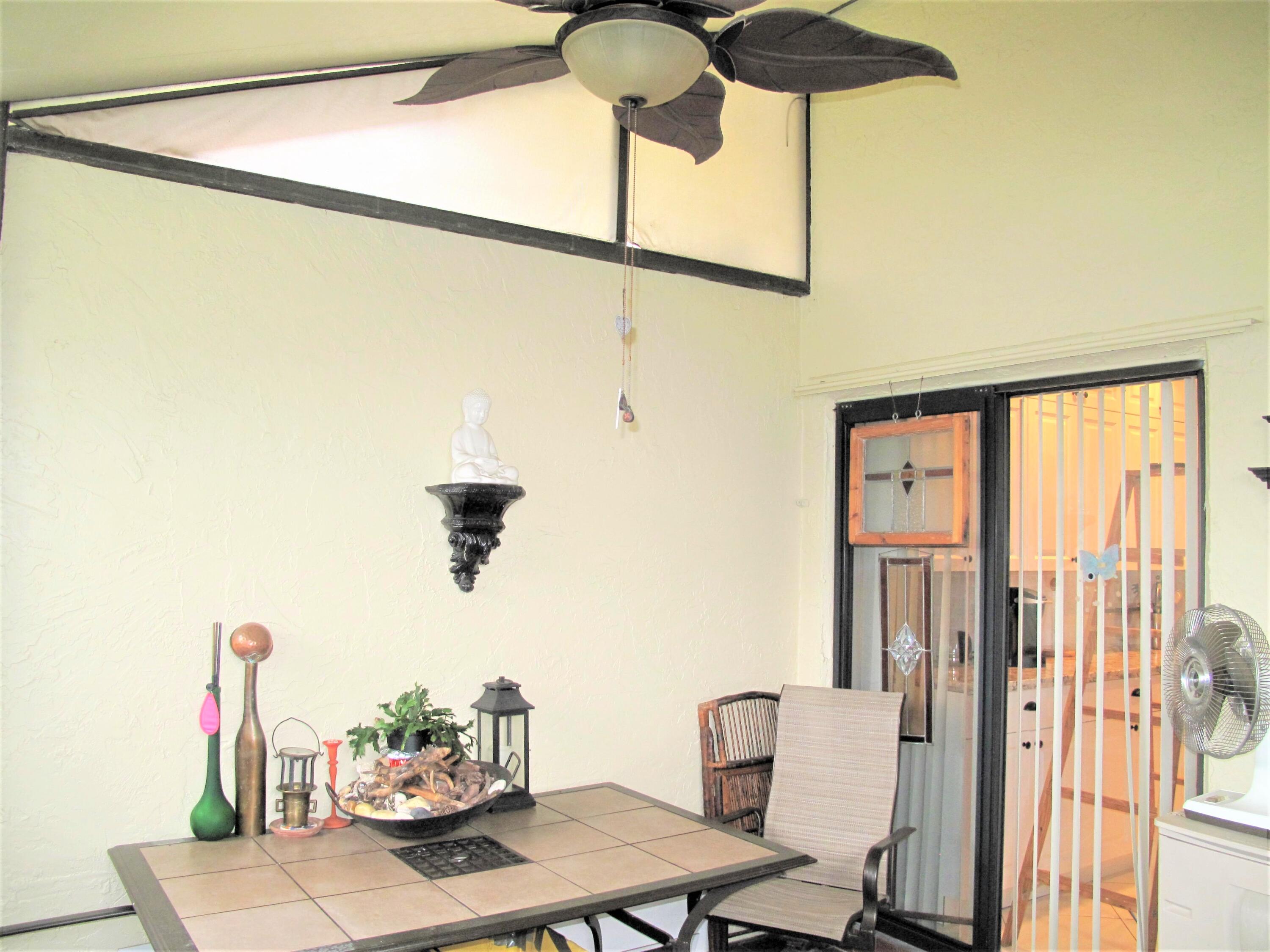 5031 Nesting Way, Unit D Delray Beach, FL 33484 - Photo 3 of 35 Front enclosed patio (2)