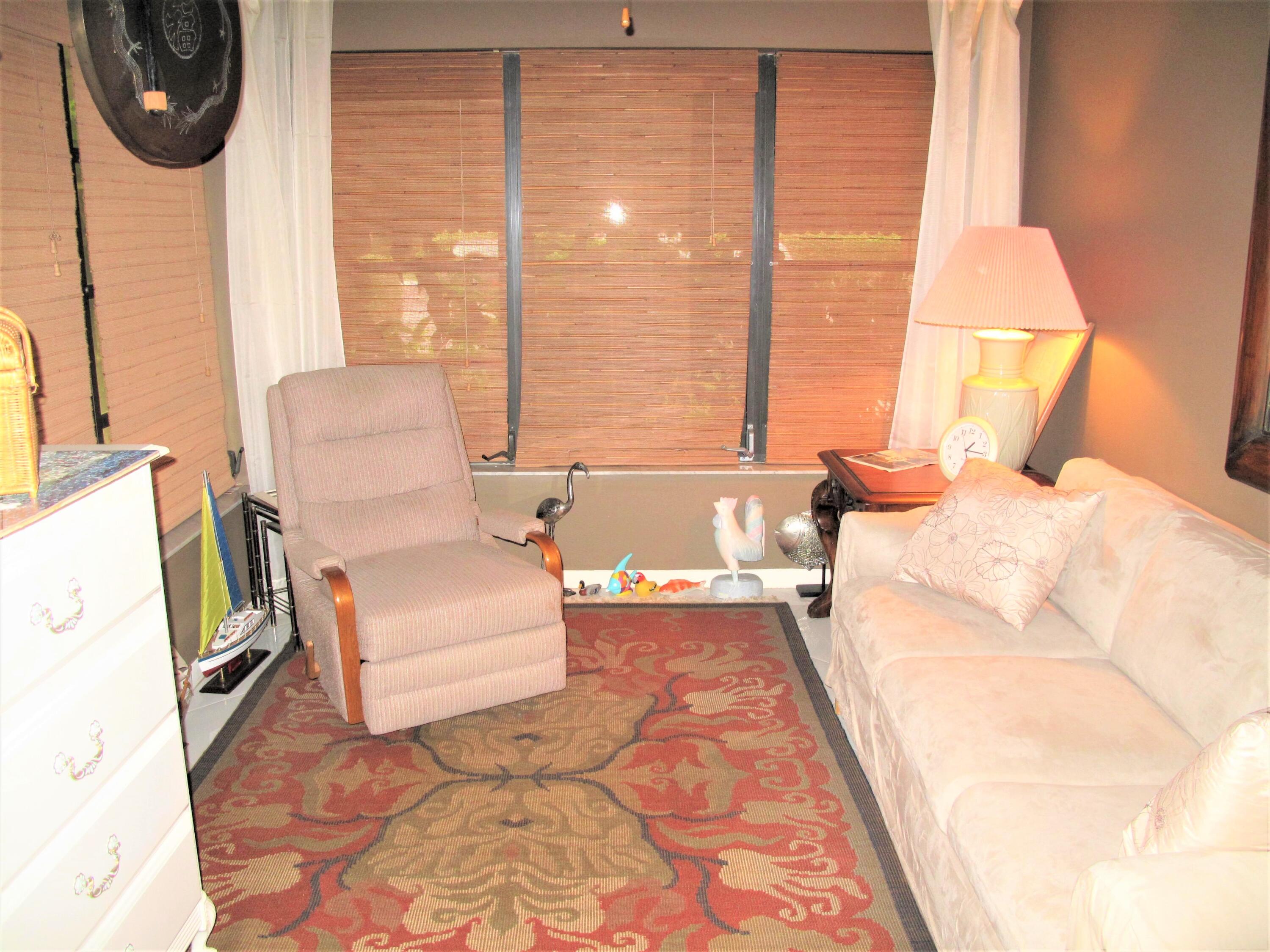 5031 Nesting Way, Unit D Delray Beach, FL 33484 - Photo 5 of 35 Enclosed Florida room under air