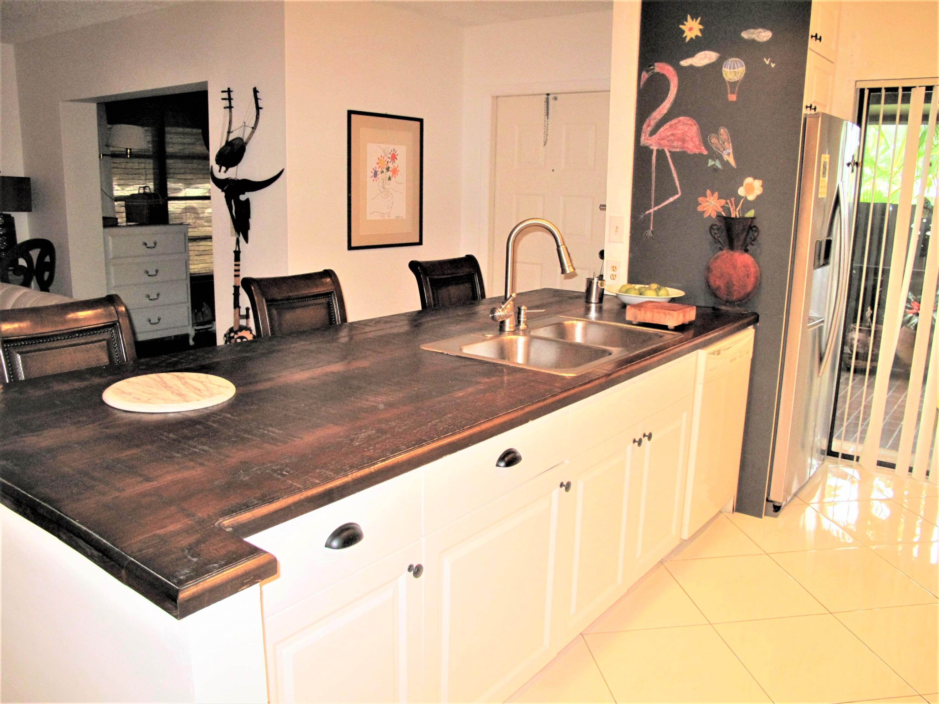 5031 Nesting Way, Unit D Delray Beach, FL 33484 - Photo 10 of 35 Remodeled open concept kitchen (2)