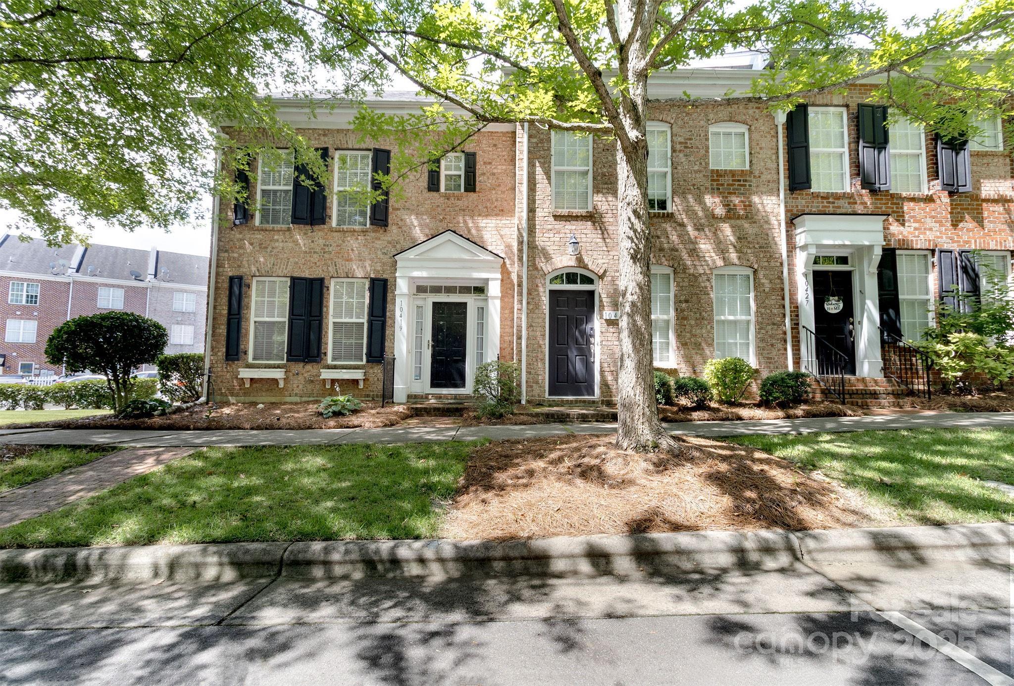 10419 Rocky Ford Club Road Charlotte, NC 28078 - Photo 1 of 37 a front view of a house with yard and green space