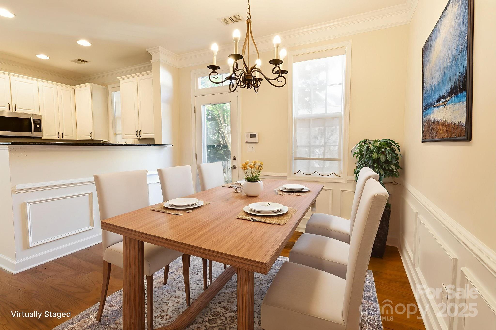10419 Rocky Ford Club Road Charlotte, NC 28078 - Photo 14 of 37 a view of a dining room with furniture and a chandelier