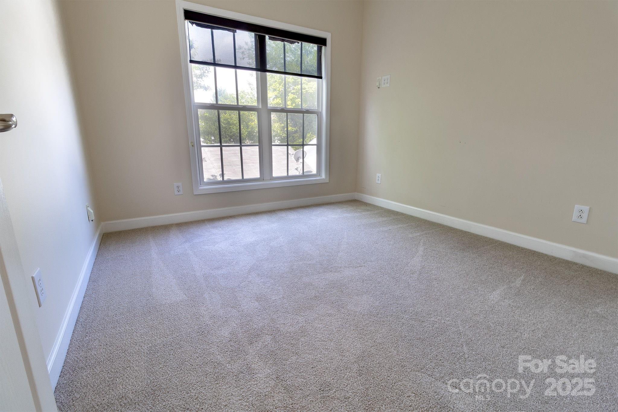 10419 Rocky Ford Club Road Charlotte, NC 28078 - Photo 20 of 37 an empty room with a window