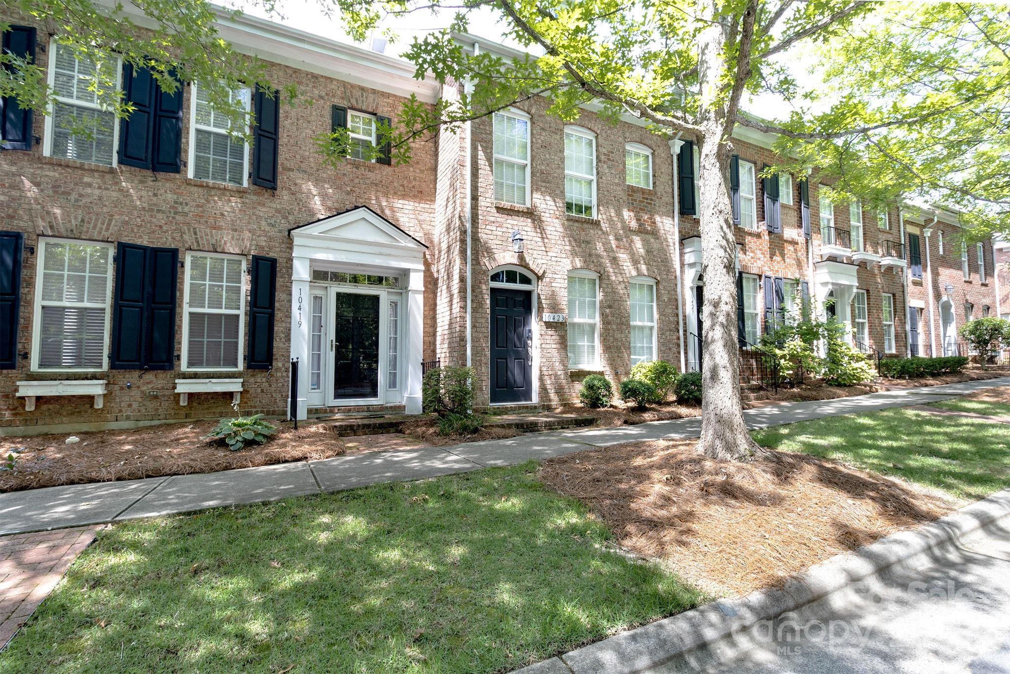 10419 Rocky Ford Club Road Charlotte, NC 28078 - Photo 2 of 37 a view of a brick house with a large windows
