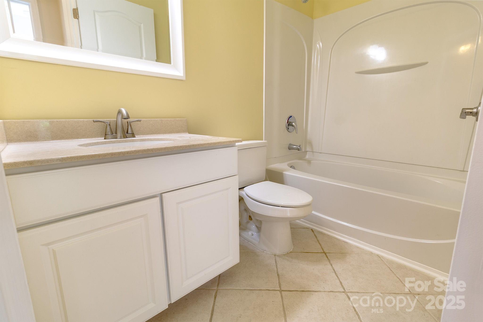 10419 Rocky Ford Club Road Charlotte, NC 28078 - Photo 24 of 37 a bathroom with a sink a toilet and shower