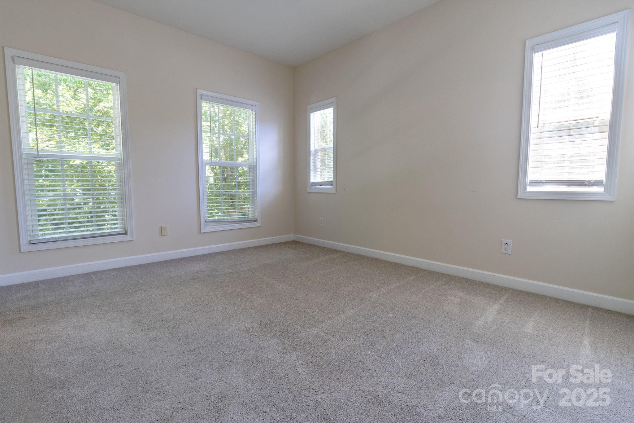 10419 Rocky Ford Club Road Charlotte, NC 28078 - Photo 26 of 37 a view of an empty room with a window