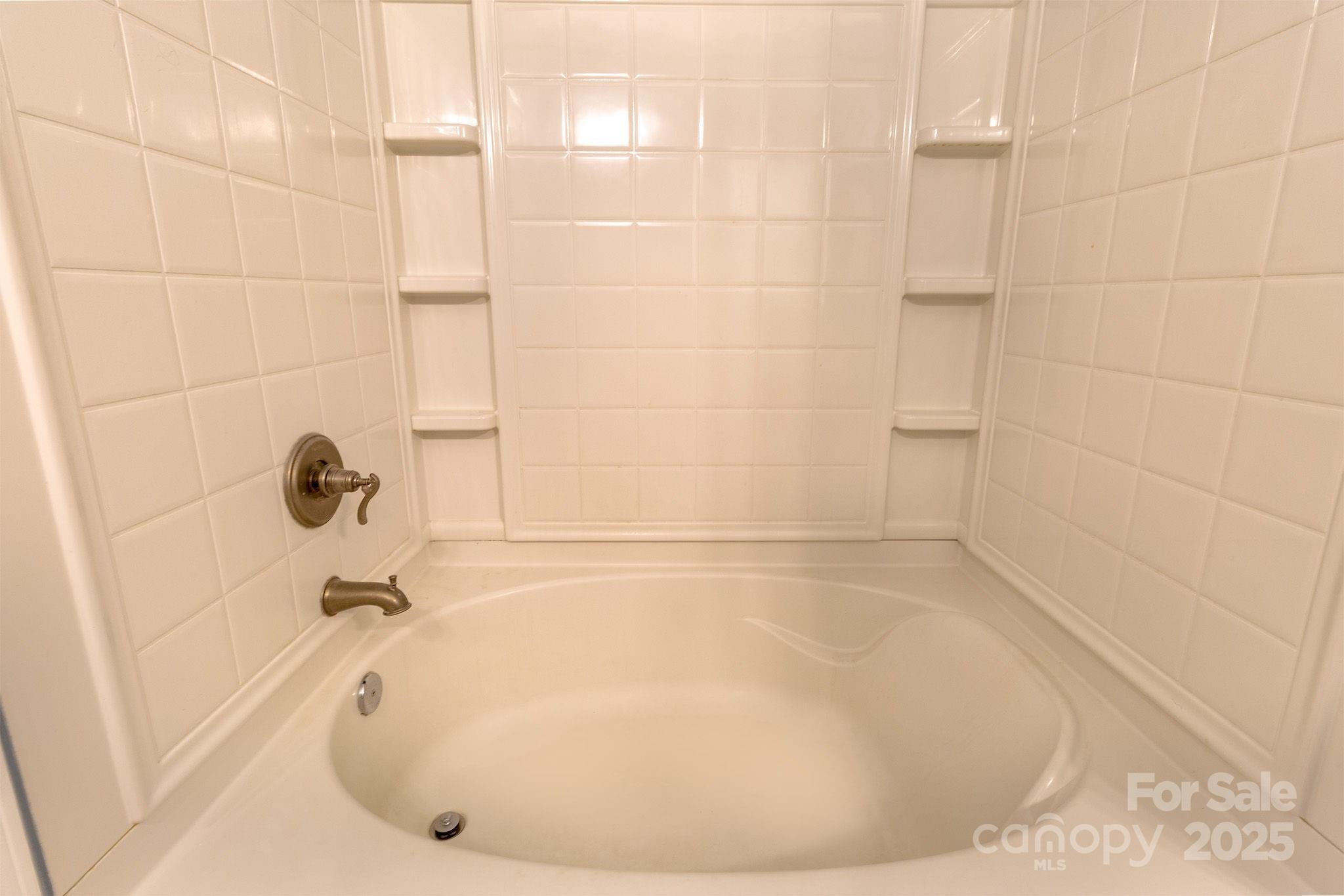 10419 Rocky Ford Club Road Charlotte, NC 28078 - Photo 30 of 37 a bathroom with a tub