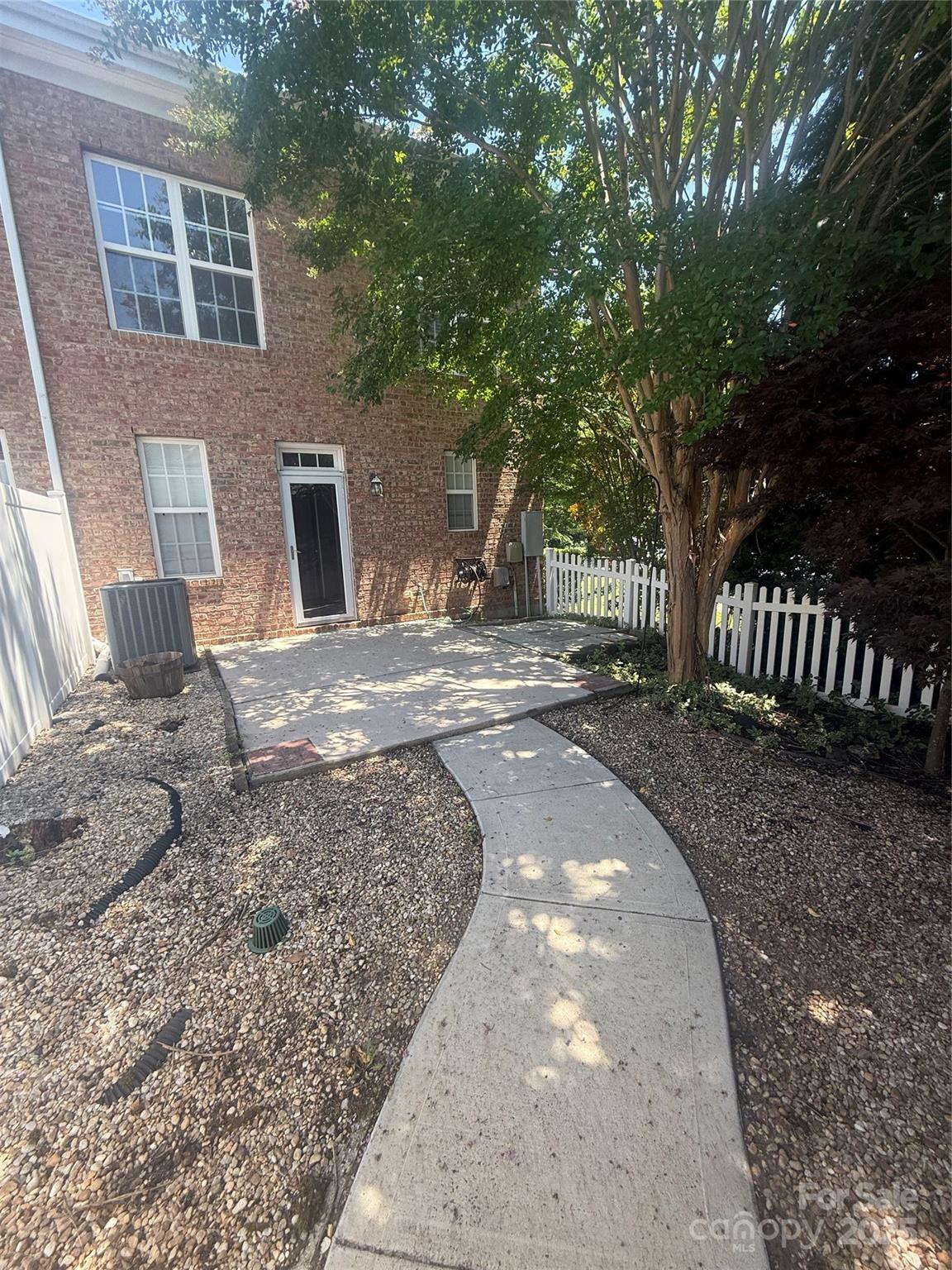 10419 Rocky Ford Club Road Charlotte, NC 28078 - Photo 34 of 37 a view of a backyard with a garden