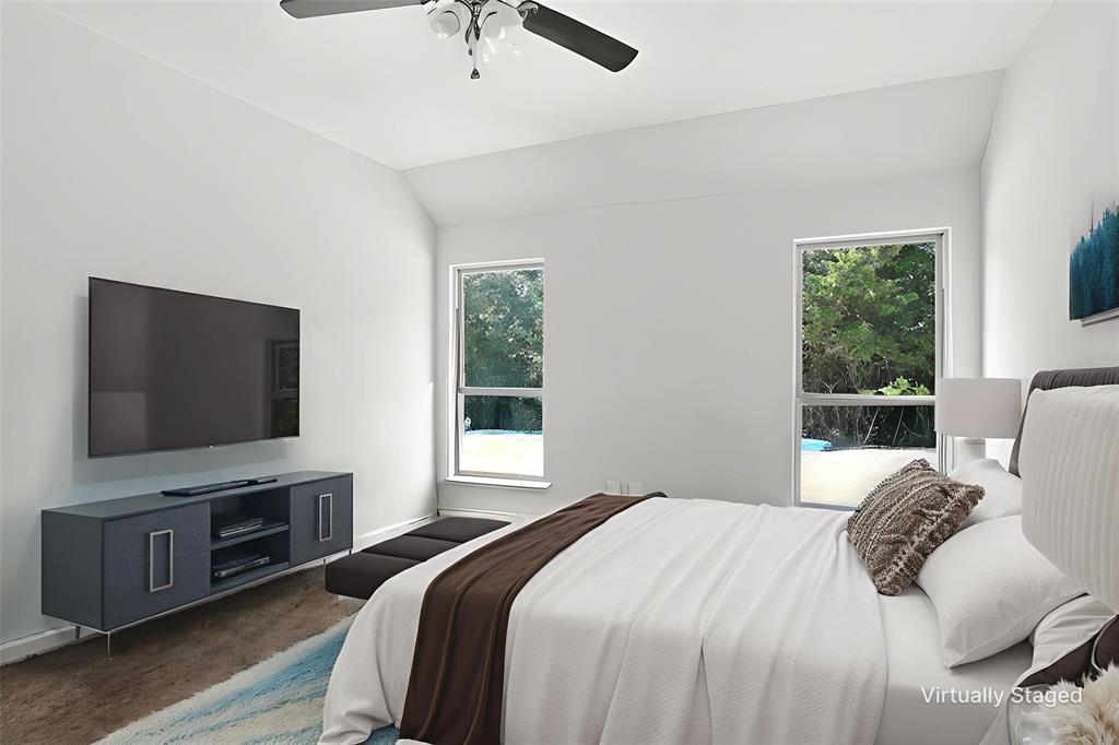 1500 Elizabeth Street Anna, TX 75409 - Photo 11 of 25 a bedroom with a bed and a flat screen tv