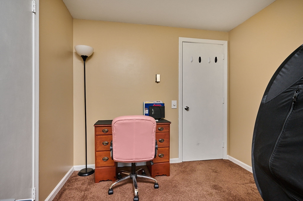 50 Phelps Street Easthampton, MA 01027 - Photo 15 of 38 a view of a workspace with furniture and a window