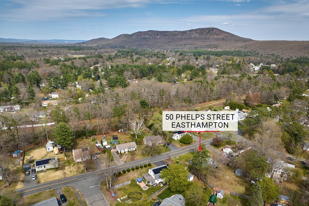 50 Phelps Street Easthampton, MA 01027 - Photo 32 of 38 a sign that is on a road