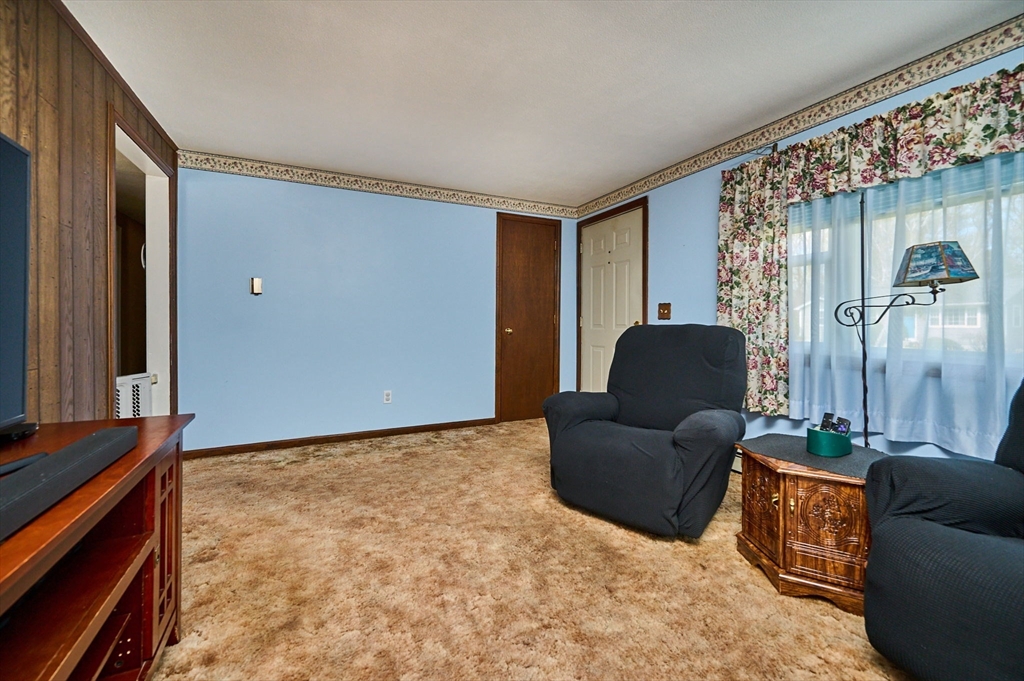 50 Phelps Street Easthampton, MA 01027 - Photo 4 of 38 a living room with furniture and a flat screen tv