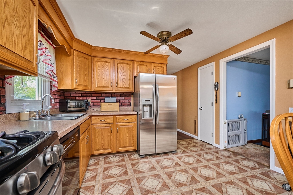 50 Phelps Street Easthampton, MA 01027 - Photo 5 of 38 a kitchen with stainless steel appliances granite countertop a refrigerator a stove and a sink