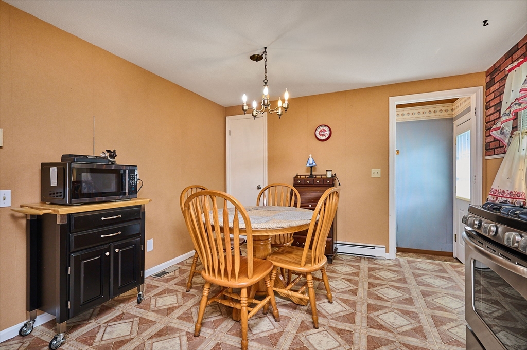 50 Phelps Street Easthampton, MA 01027 - Photo 7 of 38 a dining room with furniture and chandelier