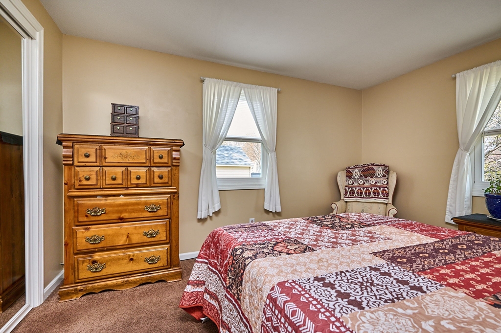 50 Phelps Street Easthampton, MA 01027 - Photo 9 of 38 a bedroom with a bed and a window