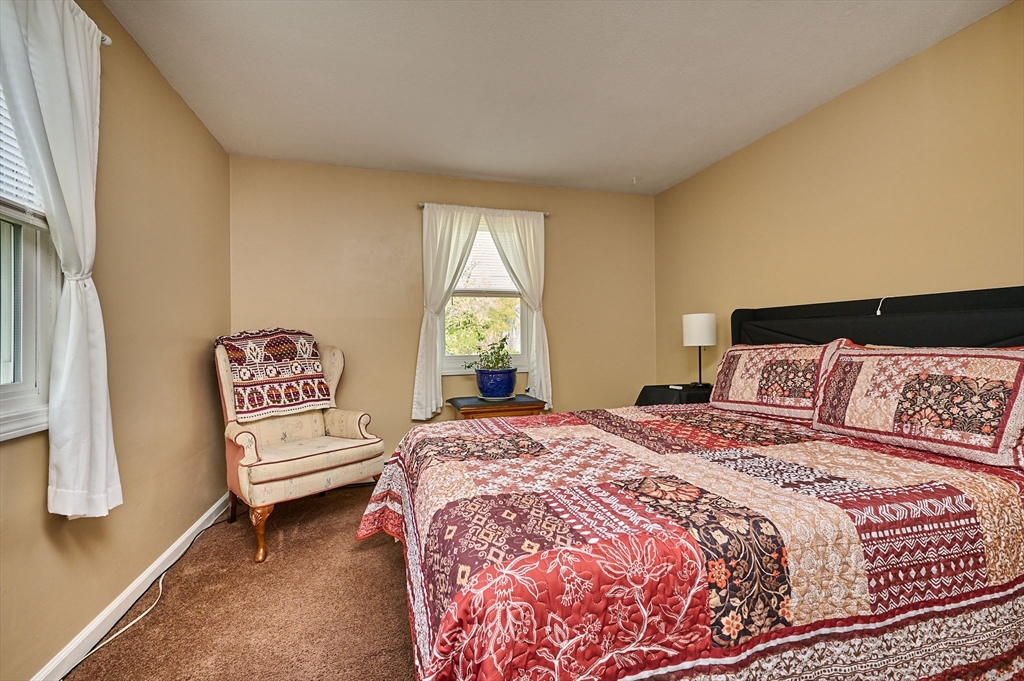 50 Phelps Street Easthampton, MA 01027 - Photo 10 of 38 a bedroom with a bed and a window