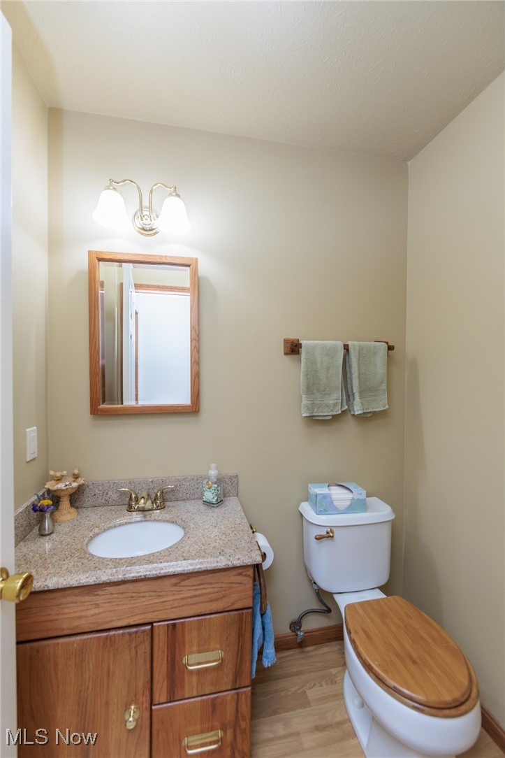 37451 Hunters Ridge Solon, OH 44139 - Photo 10 of 42 Bathroom featuring vanity and wood finished floors