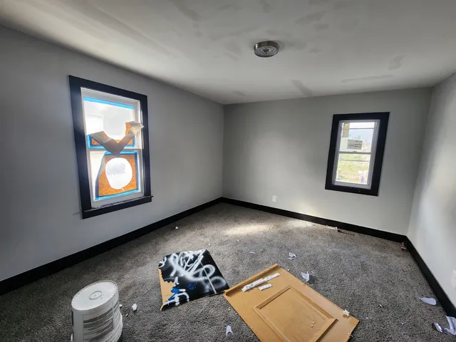 a view of an empty room with a window