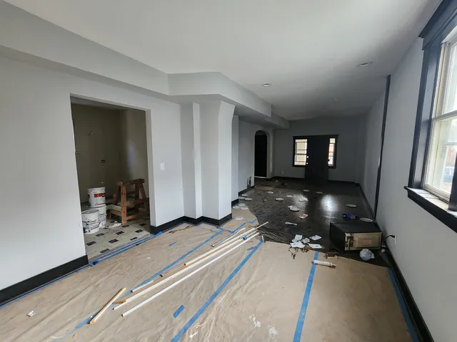 a bedroom with bed and window