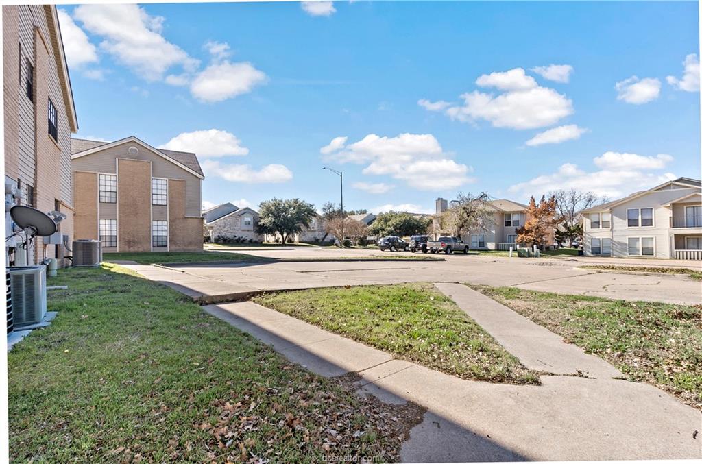 1112 Autumn Circle, Unit B College Station, TX 77840 - Photo 15 of 15 a view of a street with a building in the background