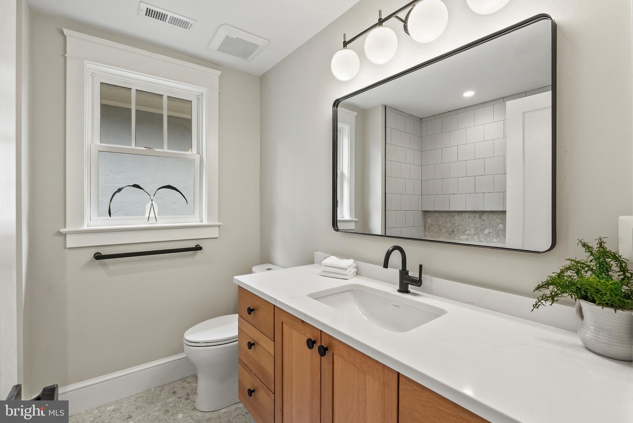 48 Murray Avenue Annapolis, MD 21401 - Photo 27 of 39 a bathroom with a sink and a mirror