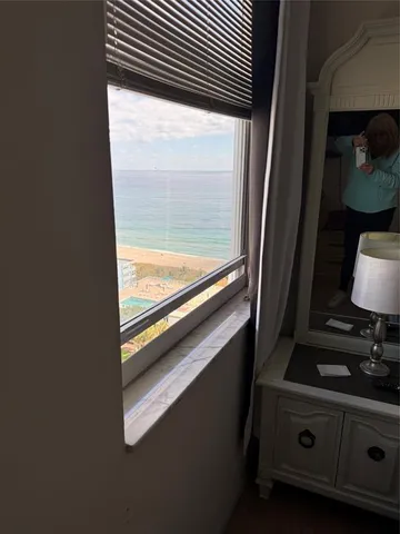a view of a balcony with wooden floor