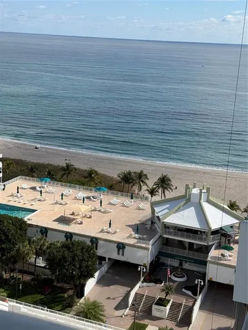 a view of a patio with table and chairs potted plants