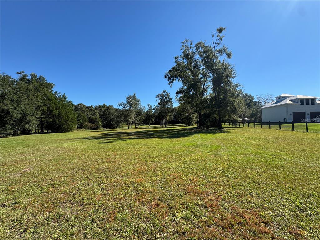 Tbd Northeast 185th Avenue Williston, FL 32696 - Photo 17 of 25 a view of a large yard with an outdoor space