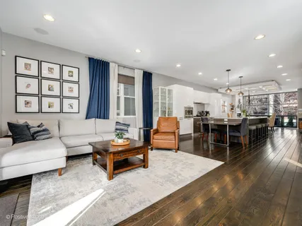 a living room with furniture fireplace and flat screen tv