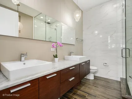 a bathroom with a bathtub and shower