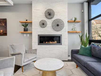 a dining room with furniture a chandelier and wooden floor