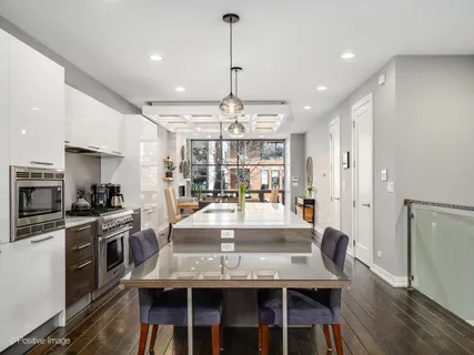a living room with fireplace furniture and a flat screen tv