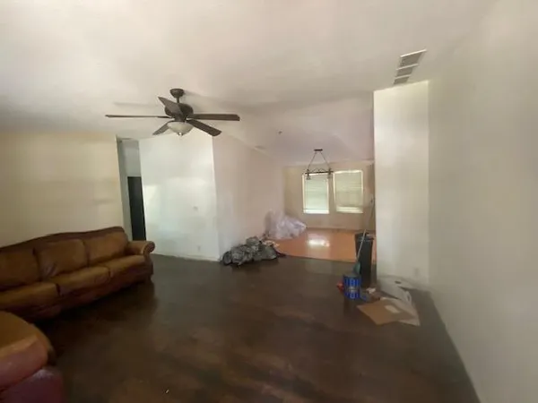 a living room with furniture and a window